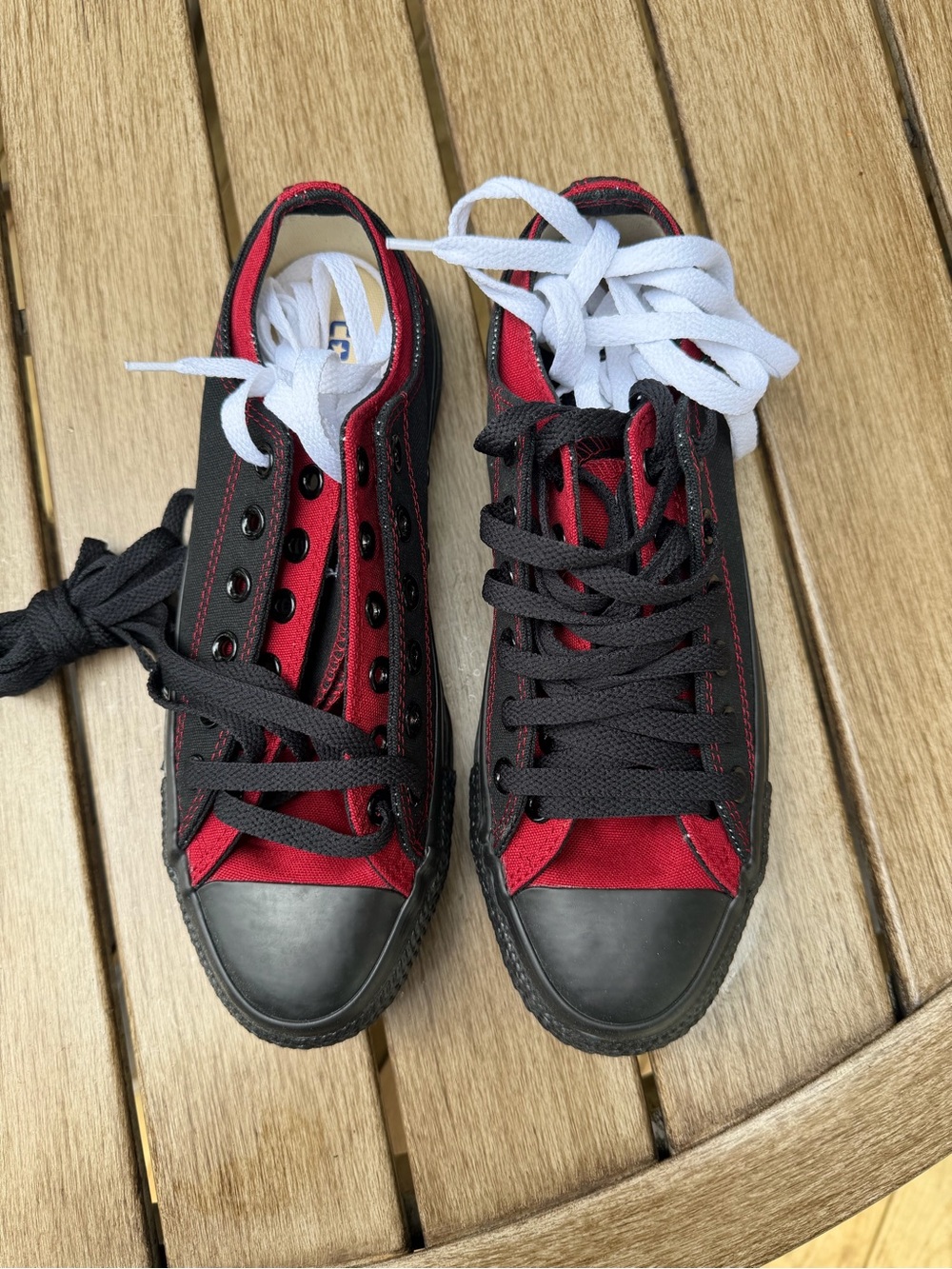 Converse Low Top Sneakers in Red and Black with White Spare Laces